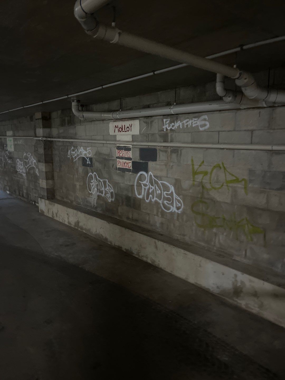 Removing Graffiti and Restoring A Dull Car Park - dark and dingy car park