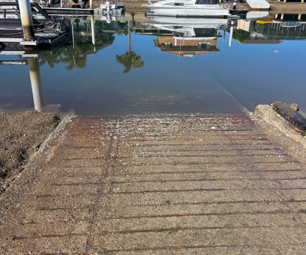 Boat Ramp cleaning - close up of ramp leading to water where mud has been removed form the surface