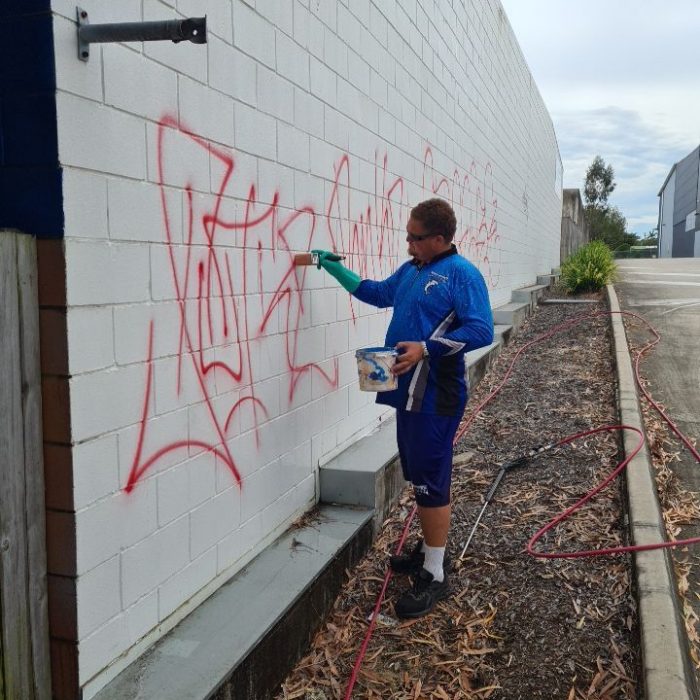 Pressure Cleaning Brisbane - worker treating wall