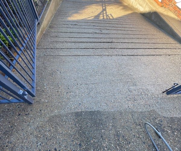 Boat Ramp cleaning - closeup of ramp in the process of being pressure washed